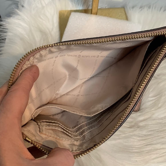 Authentic soft pink patent leather large wristlet clutch by Michael Kors